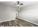 Bedroom with wood-look floors, ceiling fan, and access to bathroom at 6116 N 12Th Pl # 7, Phoenix, AZ 85014