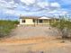 Single story home with gravel yard at 3349 N Ralston Rd, Maricopa, AZ 85139