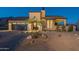 Front view of house with desert landscaping at 9633 E Quarter Circle Loop, Gold Canyon, AZ 85118