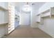 Bright walk-in closet with built-in shelving and rod system at 9633 E Quarter Circle Loop, Gold Canyon, AZ 85118