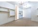 Large walk-in closet, custom built-ins, and modern chandelier at 9633 E Quarter Circle Loop, Gold Canyon, AZ 85118
