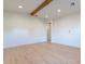 Light-filled bedroom with wood flooring and access to a bathroom at 9633 E Quarter Circle Loop, Gold Canyon, AZ 85118