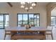 Bright dining room with large windows and a view of the backyard pool at 9633 E Quarter Circle Loop, Gold Canyon, AZ 85118