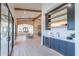 Elegant wet bar with dark cabinetry, quartz countertops, and wine cooler at 9633 E Quarter Circle Loop, Gold Canyon, AZ 85118