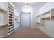 Spacious walk-in closet with built-in shelves and rods at 9633 E Quarter Circle Loop, Gold Canyon, AZ 85118
