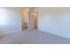 Spacious bedroom with plush carpeting and ensuite bathroom access at 9633 E Quarter Circle Loop, Gold Canyon, AZ 85118