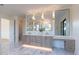Double vanity bathroom with marble countertops and large mirrors at 9633 E Quarter Circle Loop, Gold Canyon, AZ 85118