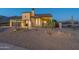 Front view of charming house with desert landscaping at 9633 E Quarter Circle Loop, Gold Canyon, AZ 85118