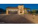 Front view of house with desert landscaping at 9633 E Quarter Circle Loop, Gold Canyon, AZ 85118