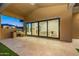 Outdoor patio with built-in grill and glass doors leading to living area at 9633 E Quarter Circle Loop, Gold Canyon, AZ 85118