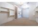 Large walk-in closet with custom shelving and lighting at 9633 E Quarter Circle Loop, Gold Canyon, AZ 85118