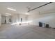 Large garage featuring high ceilings, extra storage, and natural light at 9633 E Quarter Circle Loop, Gold Canyon, AZ 85118
