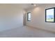 Bright bedroom with neutral carpeting and mountain views at 9633 E Quarter Circle Loop, Gold Canyon, AZ 85118