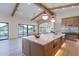 Gourmet kitchen with island, stainless steel appliances, and view of the backyard at 9633 E Quarter Circle Loop, Gold Canyon, AZ 85118