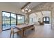 Open dining area with light wood table, bench seating and views of the golf course at 9633 E Quarter Circle Loop, Gold Canyon, AZ 85118