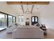 Spacious living room with high ceilings, exposed beams, and fireplace at 9633 E Quarter Circle Loop, Gold Canyon, AZ 85118