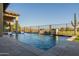 Inviting rectangular pool with fountains and swim-up lounge chairs at 9633 E Quarter Circle Loop, Gold Canyon, AZ 85118