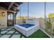 Relaxing hot tub with mountain views, stone accents, and artificial turf at 9633 E Quarter Circle Loop, Gold Canyon, AZ 85118