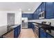 Modern kitchen with stainless steel appliances and a center island at 4506 W Maggie Dr, San Tan Valley, AZ 85144