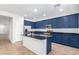 Modern kitchen with blue cabinets, granite countertops and island at 4506 W Maggie Dr, San Tan Valley, AZ 85144
