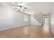 Spacious living room with tile floors, ceiling fan, and staircase at 4506 W Maggie Dr, San Tan Valley, AZ 85144