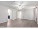 Bright bedroom with wood-look floors and bathroom access at 4506 W Maggie Dr, San Tan Valley, AZ 85144