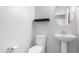 Clean and bright bathroom with pedestal sink and toilet at 4506 W Maggie Dr, San Tan Valley, AZ 85144