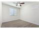 Bedroom with wood-look floors, ceiling fan, and window blinds at 4506 W Maggie Dr, San Tan Valley, AZ 85144