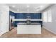 Modern kitchen with stainless steel appliances and blue cabinets at 4506 W Maggie Dr, San Tan Valley, AZ 85144