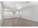 Spacious loft area with wood-look floors and a white railing at 4506 W Maggie Dr, San Tan Valley, AZ 85144