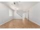 Spacious living room with tile floors, ceiling fan, and staircase at 4506 W Maggie Dr, San Tan Valley, AZ 85144
