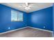 Blue bedroom with wood-look floors and a ceiling fan at 4506 W Maggie Dr, San Tan Valley, AZ 85144