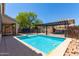 Inviting backyard pool with pergola and patio at 4506 W Maggie Dr, San Tan Valley, AZ 85144