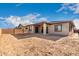 Backyard view of a single-story house with a covered patio at 21856 E Saddle E Ct, Queen Creek, AZ 85142