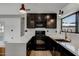 Modern kitchen with dark cabinets and quartz countertops at 2927 N 29Th Pl, Phoenix, AZ 85016