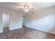 Well-lit bedroom with wood floors and access to hallway at 4943 E Indian School Rd # 4, Phoenix, AZ 85018