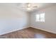 Bright bedroom with wood-look floors and ceiling fan at 4943 E Indian School Rd # 4, Phoenix, AZ 85018