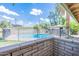 Community pool with brick wall and mountain views at 4943 E Indian School Rd # 4, Phoenix, AZ 85018
