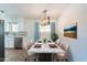 Modern dining room with marble table and chandelier at 4943 E Indian School Rd # 4, Phoenix, AZ 85018