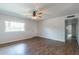 Bright living room with hardwood floors and ceiling fan at 4943 E Indian School Rd # 4, Phoenix, AZ 85018