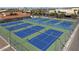 Aerial view of multiple tennis courts with surrounding fencing at 5729 S 243Rd Dr, Buckeye, AZ 85326