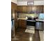 Bright kitchen with stainless steel appliances and wood cabinets at 2460 E Main St # G3, Mesa, AZ 85213