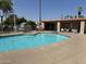 Community pool with seating area at 2460 E Main St # G3, Mesa, AZ 85213