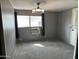 Spacious bedroom with ceiling fan and window coverings at 2460 E Main St # G3, Mesa, AZ 85213