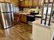 Modern kitchen features stainless steel appliances and wood cabinets at 2460 E Main St # G3, Mesa, AZ 85213