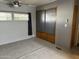 Bedroom with sliding door closet and window at 2460 E Main St # G3, Mesa, AZ 85213
