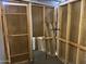 Unfinished storage room with wooden walls and a mirror at 2460 E Main St # G3, Mesa, AZ 85213