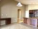 Spacious kitchen with island, dark wood cabinets, and stainless steel appliances at 21978 N Dietz Dr, Maricopa, AZ 85138