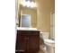 Bathroom features dark wood vanity, single sink and toilet at 21978 N Dietz Dr, Maricopa, AZ 85138