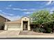 Single-story home with a two-car garage and desert landscaping at 21978 N Dietz Dr, Maricopa, AZ 85138